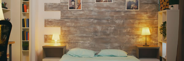 bedroom feature wall with paintings on the wall